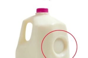 Purpose of the Circular Dent on Milk Jugs!
